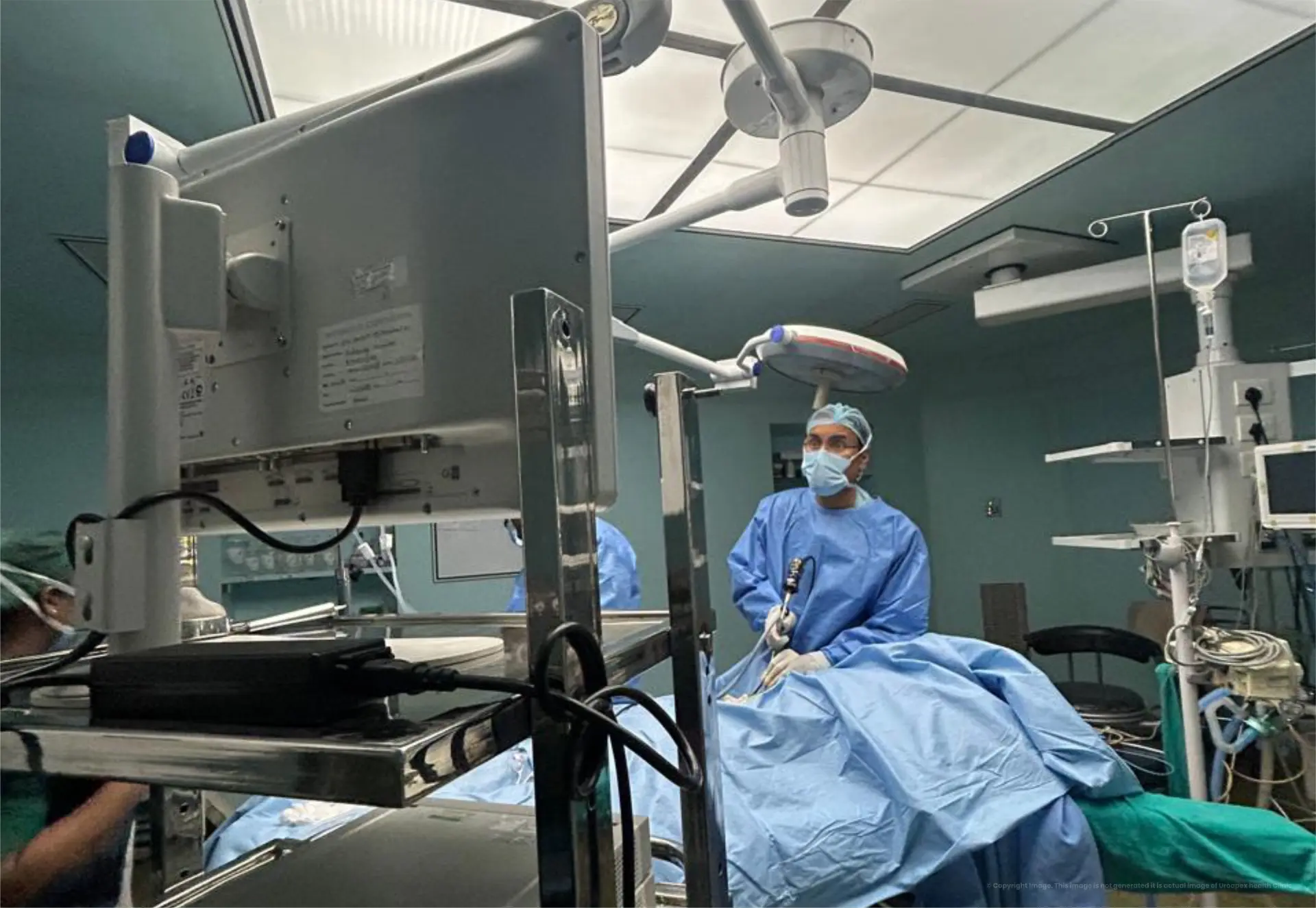 Dr. Ashwani Pandey performing a urological procedure in the operating theatre at URO Apex Health